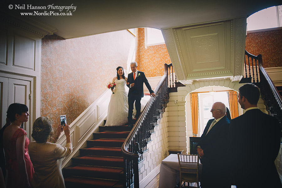 Brid and her Father walking down the stairs at Ardington House to a small wedding ceremony