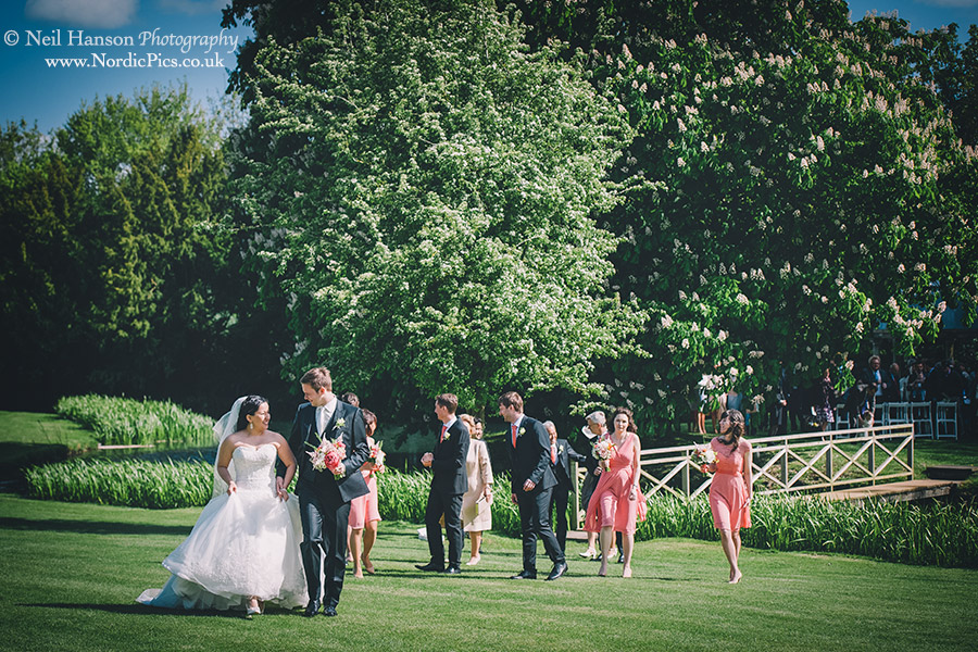 Bride and Groom leading their Wedding party to the drinks reception at Ardington House
