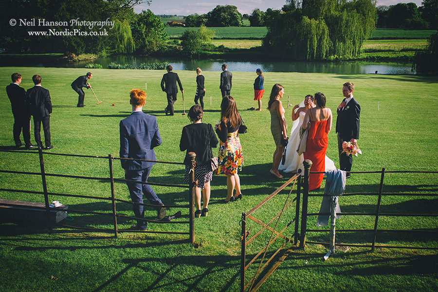 Wedding guest playing croquet