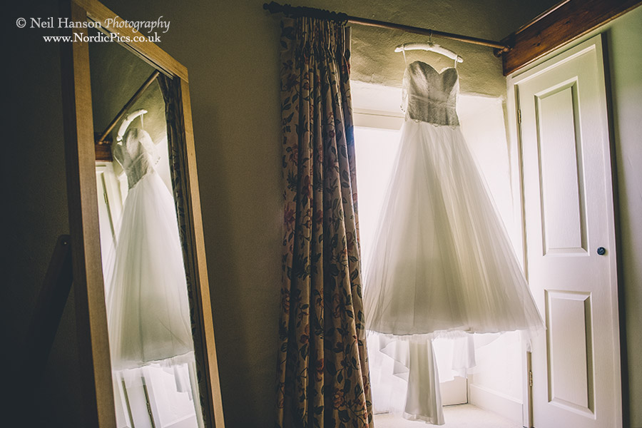 Wedding dress hanging up in the Coach House at Caswell House