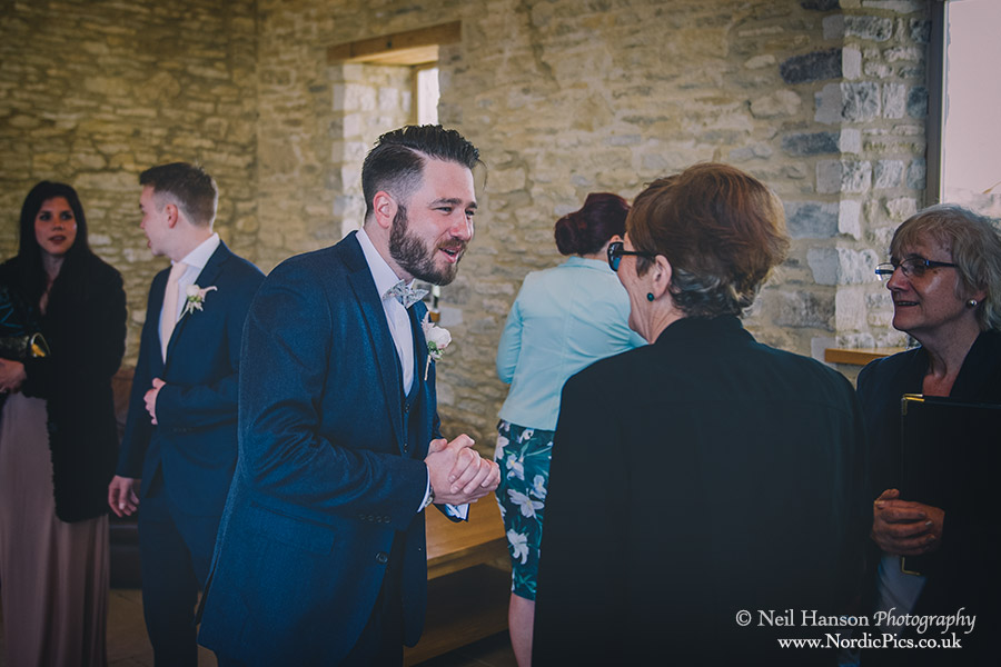 Groom greeting guests as they arrive at a Caswell House Wedding