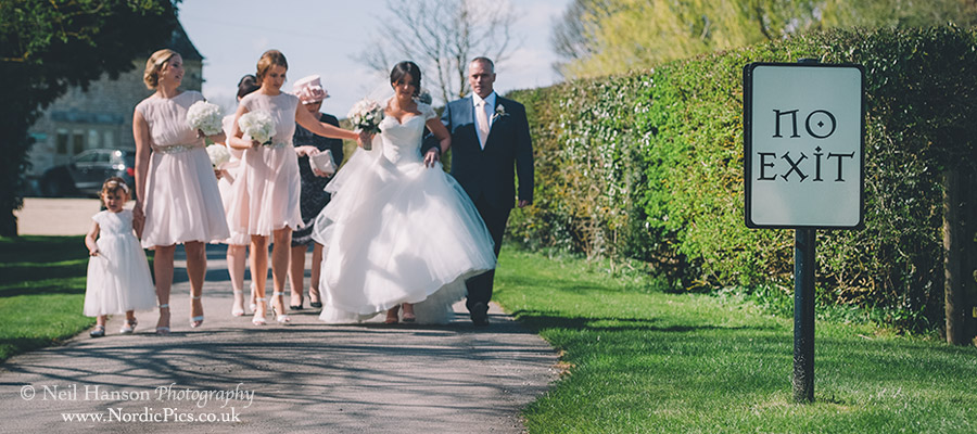 Bridal party walking to the outdoor ceremony at Caswell House