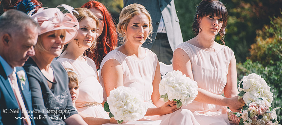 Bridemaids watching the wedding ceremony at Caswell House