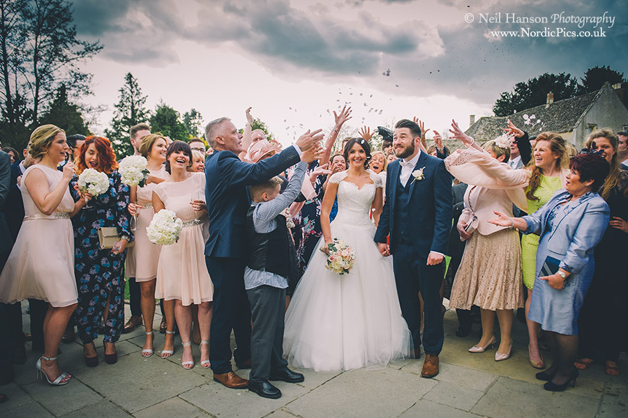 Confetti being thrown at Caswell House Wedding