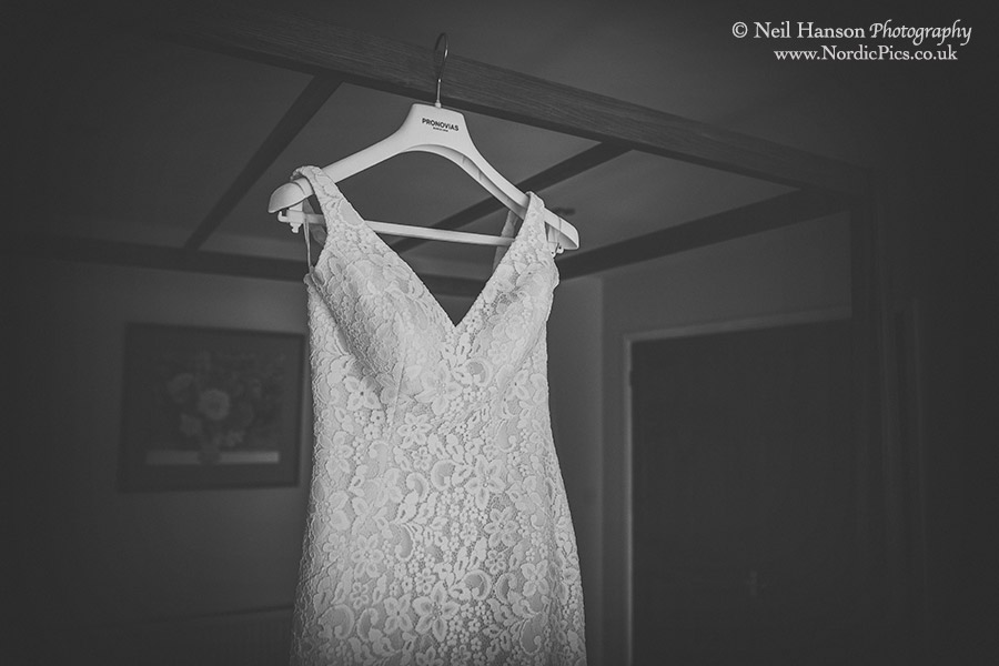 Wedding dress hanging up at Worton Hall