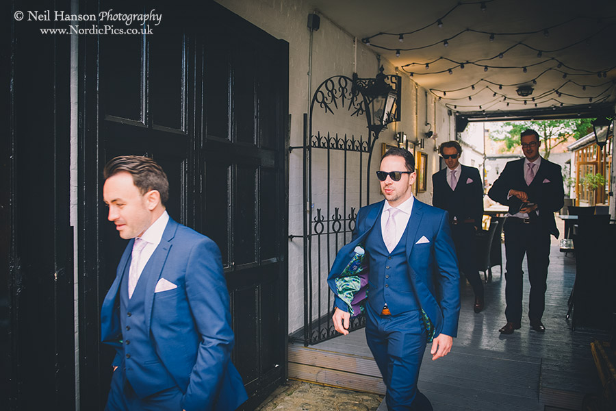 Alex and his groomsmen walking too St Nicolas church in Abingdon