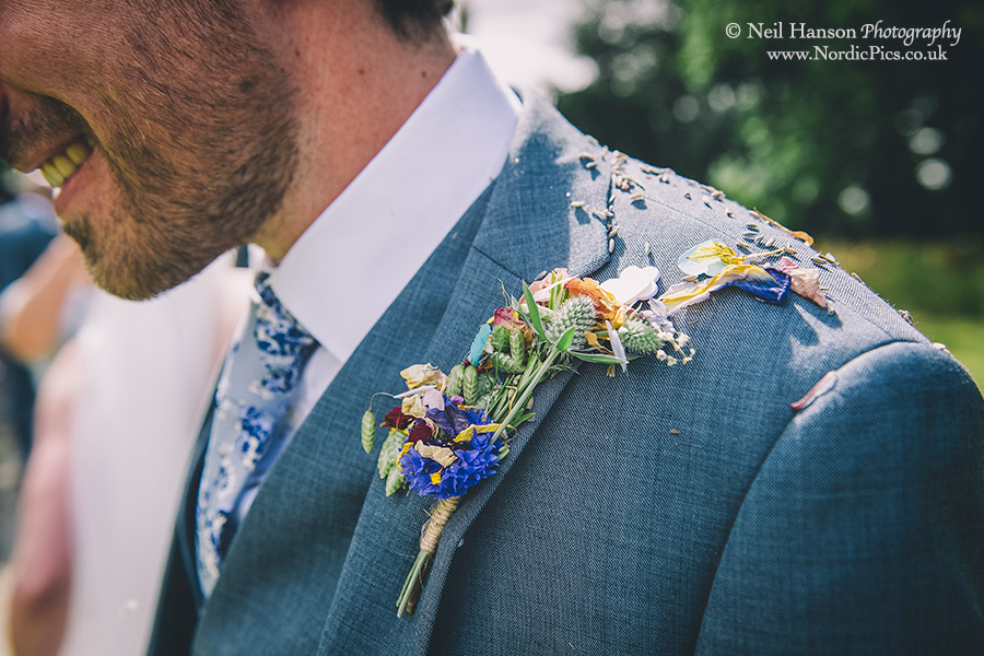Confetti on the grooms buttonhole