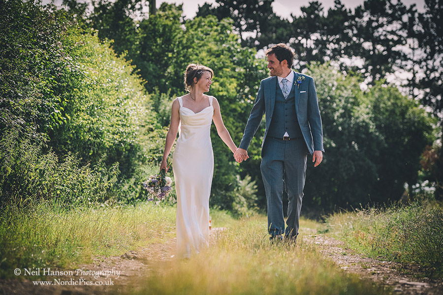 Bride and Groom walking in the Cotswolds