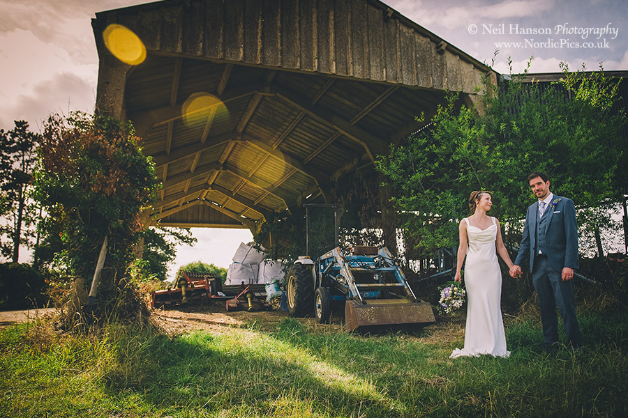 Bride and Groom on a farm with Tractors