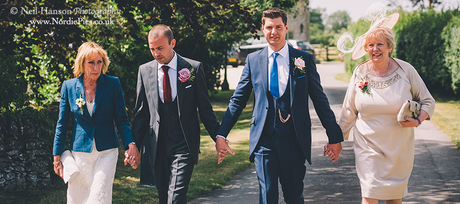Walking to their same sex wedding ceremony at Caswell House