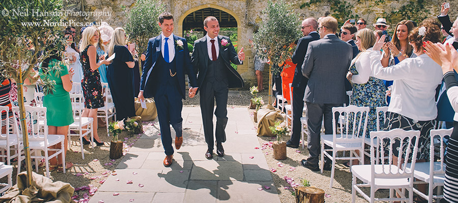 Grooms exiting their Wedding same sex ceremony at Caswell House