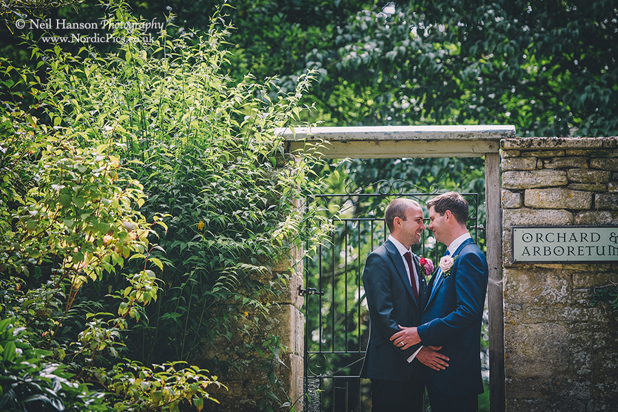 Couple enjoying their same sex wedding day in the grounds of Caswell House