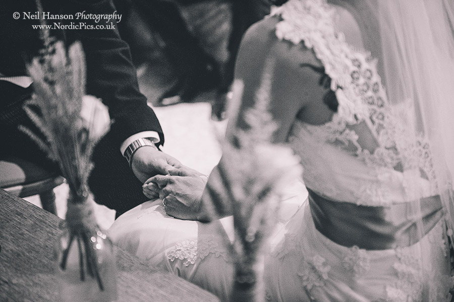 Bride and groom holding hands during the Wedding ceremony