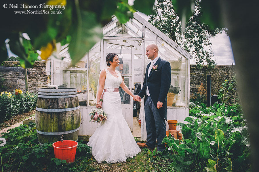 Bride and Groom in the vegetable garden at Cogges Farm