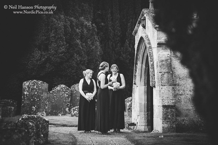 Bridesmaids waiting for the bride to arrive at Standlake church