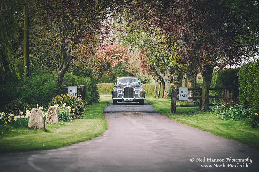 Vintage Wedding car arrives at Caswell House