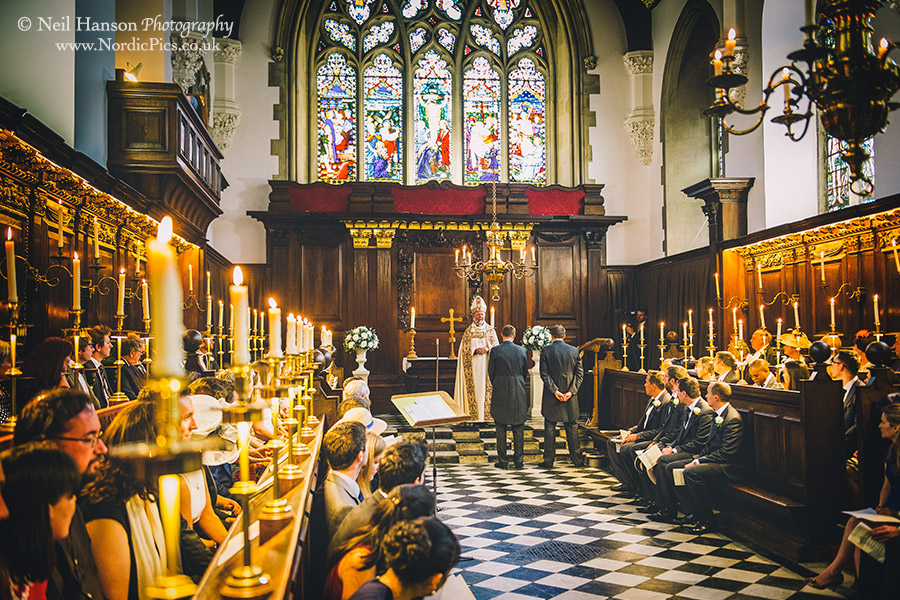 Groom waiting inside the chapel for his bride to arrive at University College Oxford