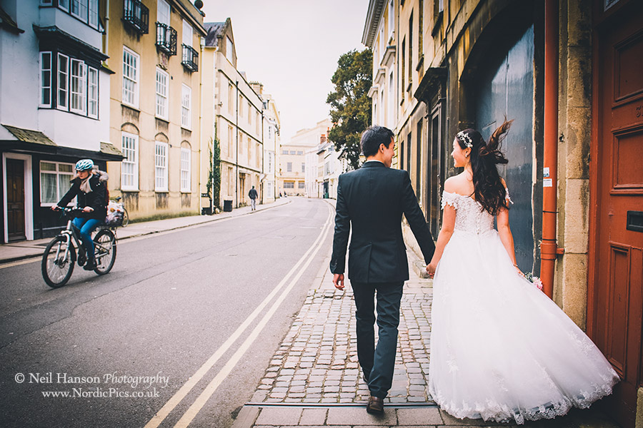 Bride and Groom walking Oxford Streets