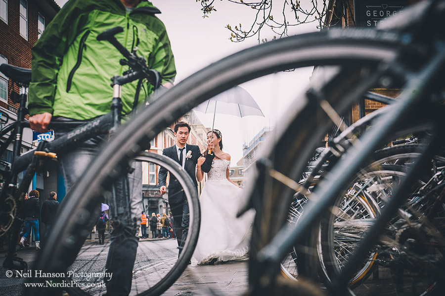 Bride and Groom with Cyclists in Oxford