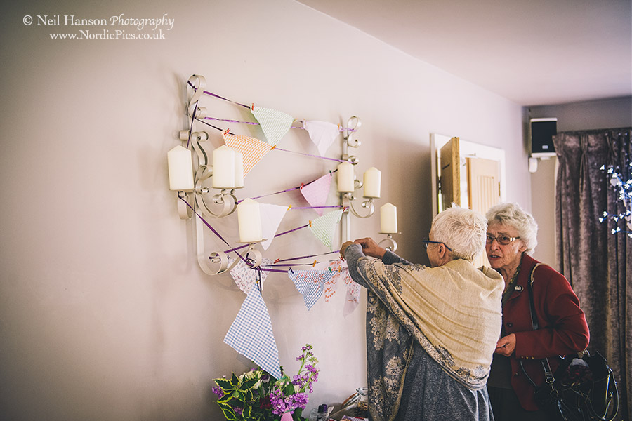 Wedding guests signing the Wedding Bunting