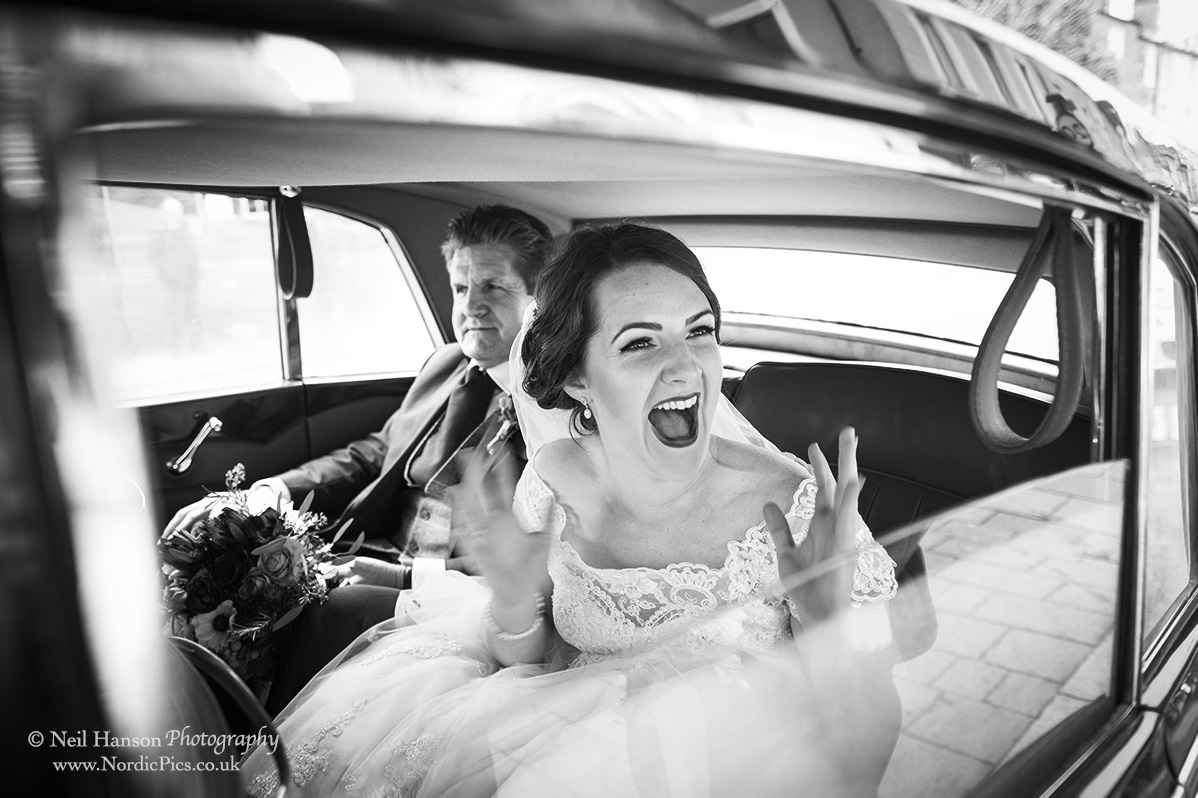 Excited bride about to enter her church before a Wedding reception at Caswell House