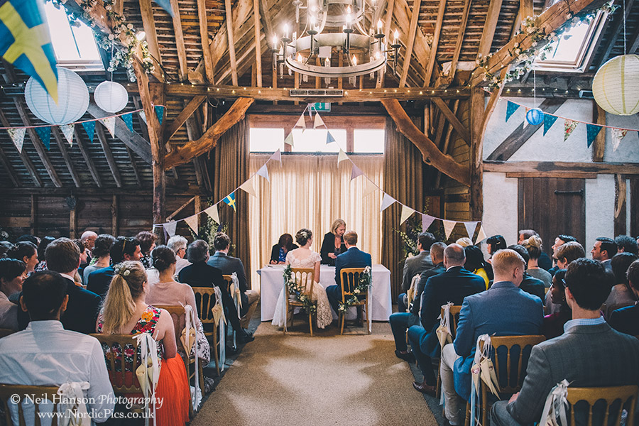 Signing of the register at a Herons farm Wedding