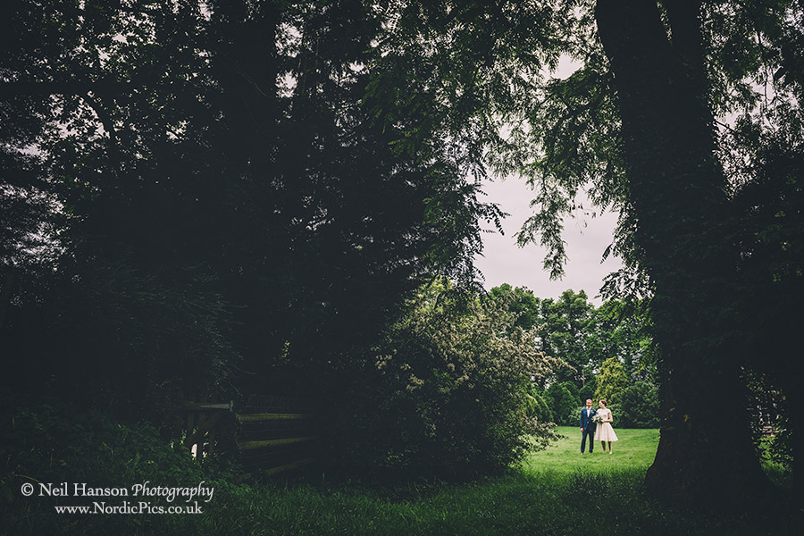 Bride and groom in the lovely grounds of Herons Farm in Berkshire