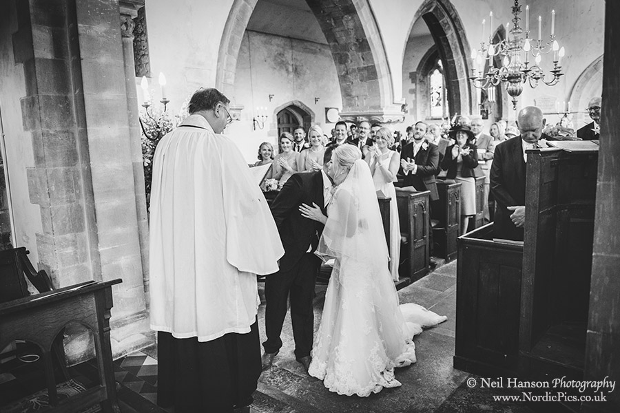 Bride and Grooms first kiss at Rousham Church