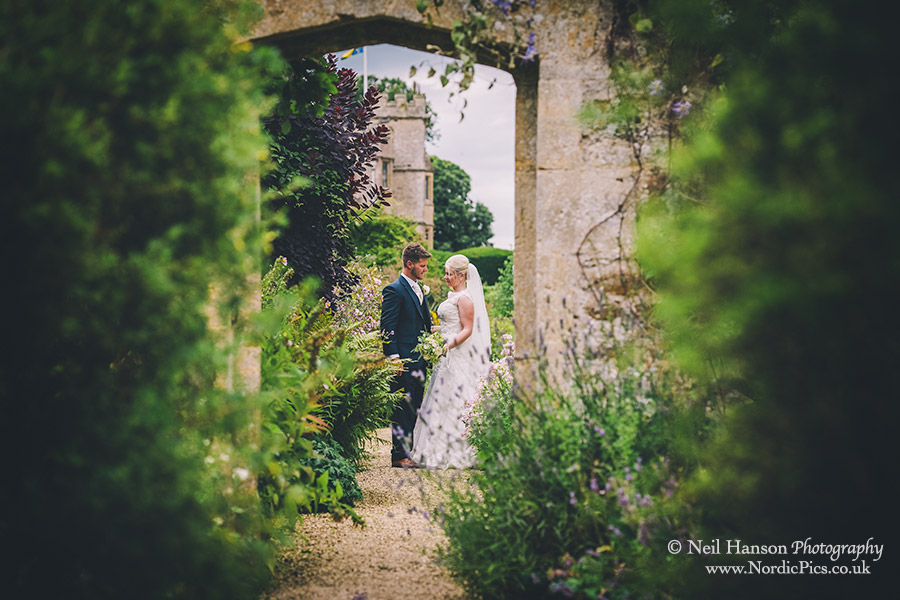 Bride and groom in Rousham House Gardens