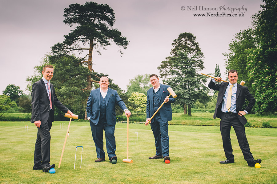 Grooms and Best Men playing croquet 