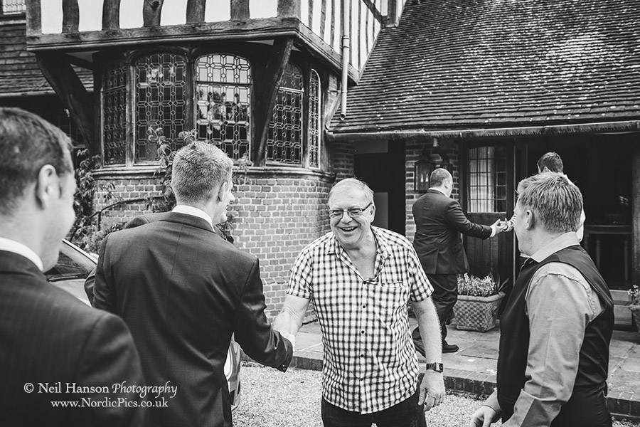 Grooms greeted by family on their Wedding day at Hever Castle