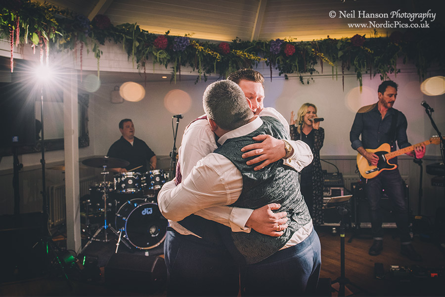 Hugs for the grooms