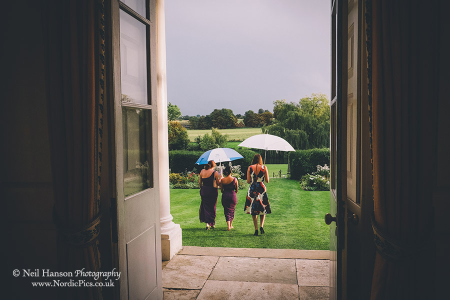 Guests heading over to the wedding marquee with storm in background