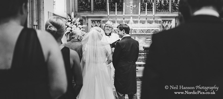 Bride and groom at the alter in Dorchester Abbey on their wedding day