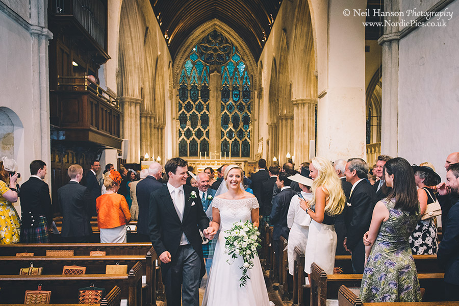 Bride and Groom exit Dorchester Abbey after their wedding ceremony