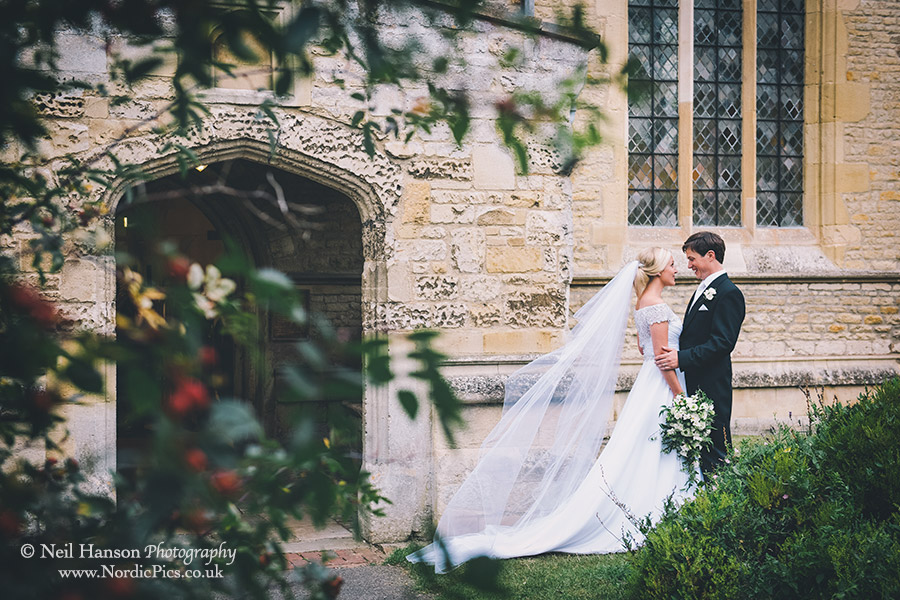 Bride and Groom having a quiet moment together outside Dorchester Abbey