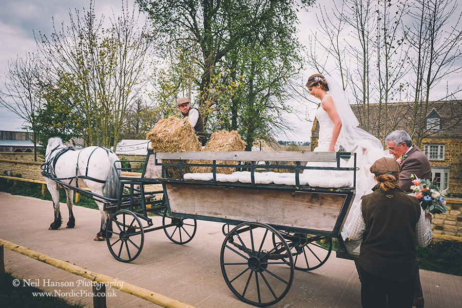 Horse and carriage for the bride too get to the wedding ceremony at Soho Farmhouse
