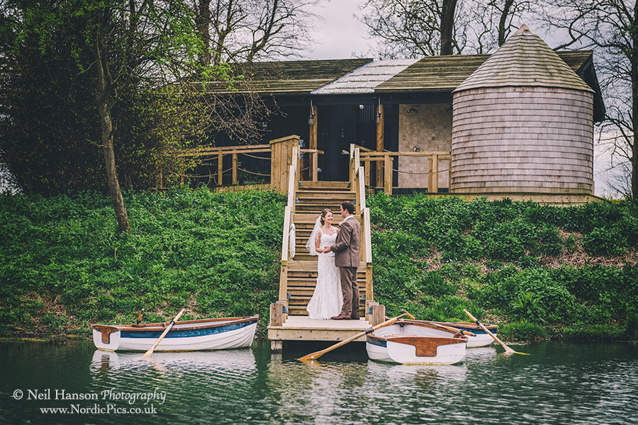 Bride and Groom at Soho Farmhouse boating lake