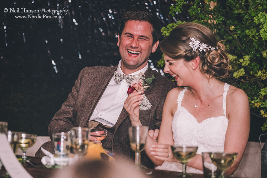 Bride and groom laughter