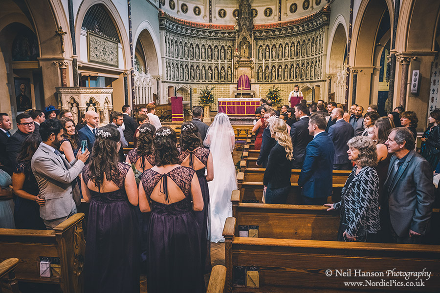 Bridal party walking down the aisle at The Oxford Oratory