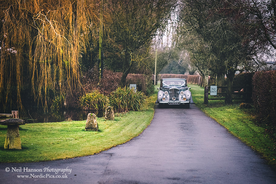 Wedding car arriving at Caswell House in Winter