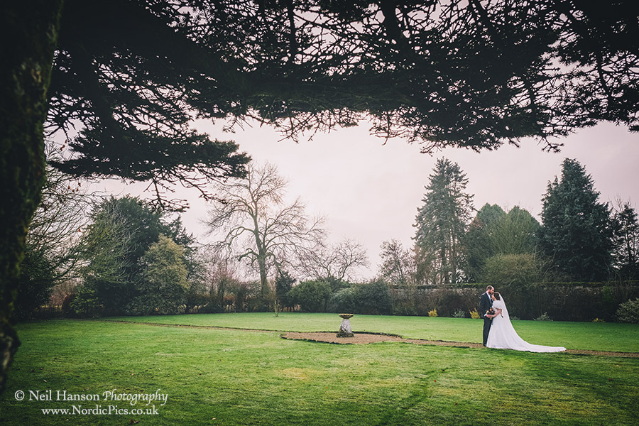 Bride and groom in the grounds of Caswell House on their Winter Wedding day