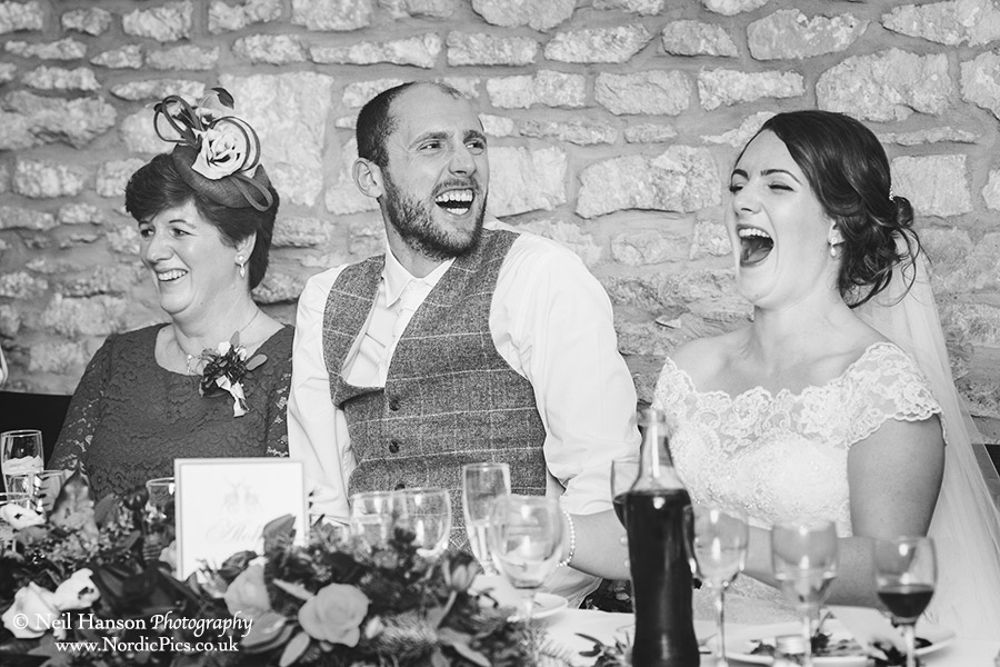 Bride and Grooms laughter at the wedding speeches