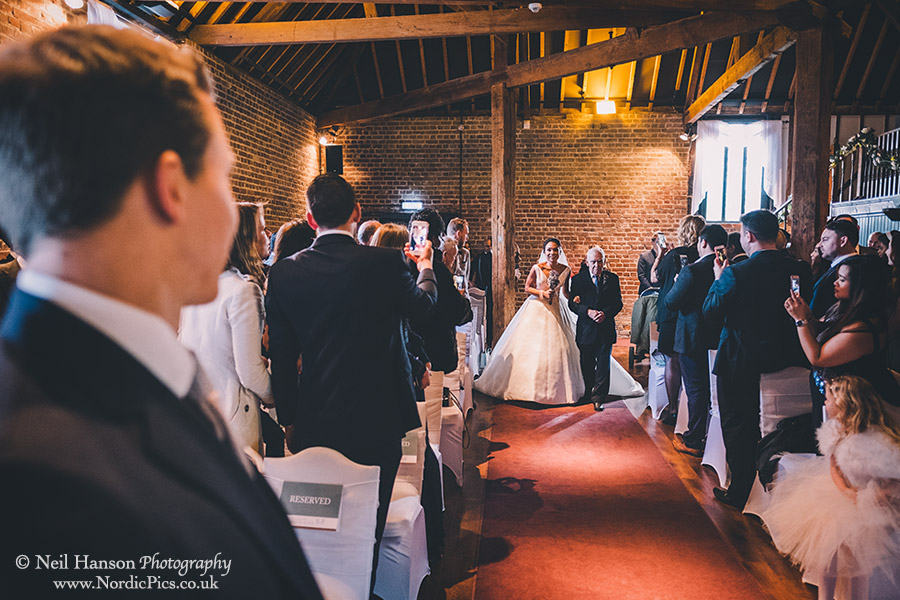 Bride & her Father walking down the aisle at Cooling Castle Barn