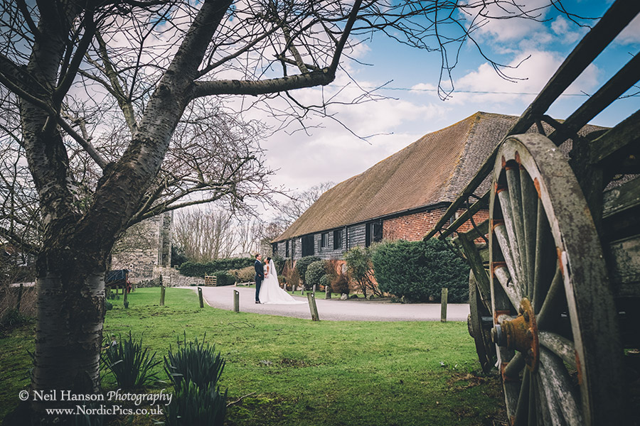 Bride & Groom in the grounds of Cooling Castle Barn Wedding Venue