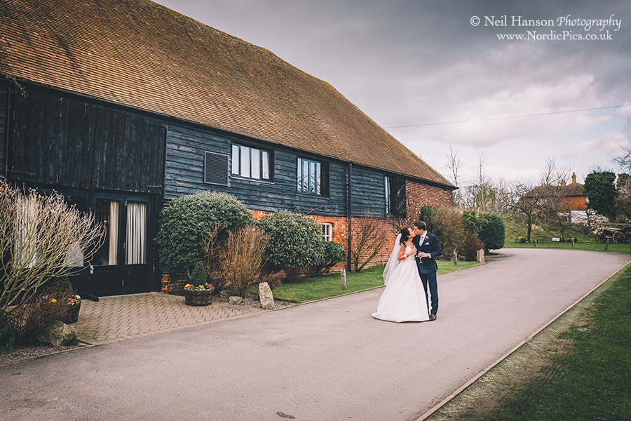 Bride and Groom on their wedding day at Cooling Castle Barn