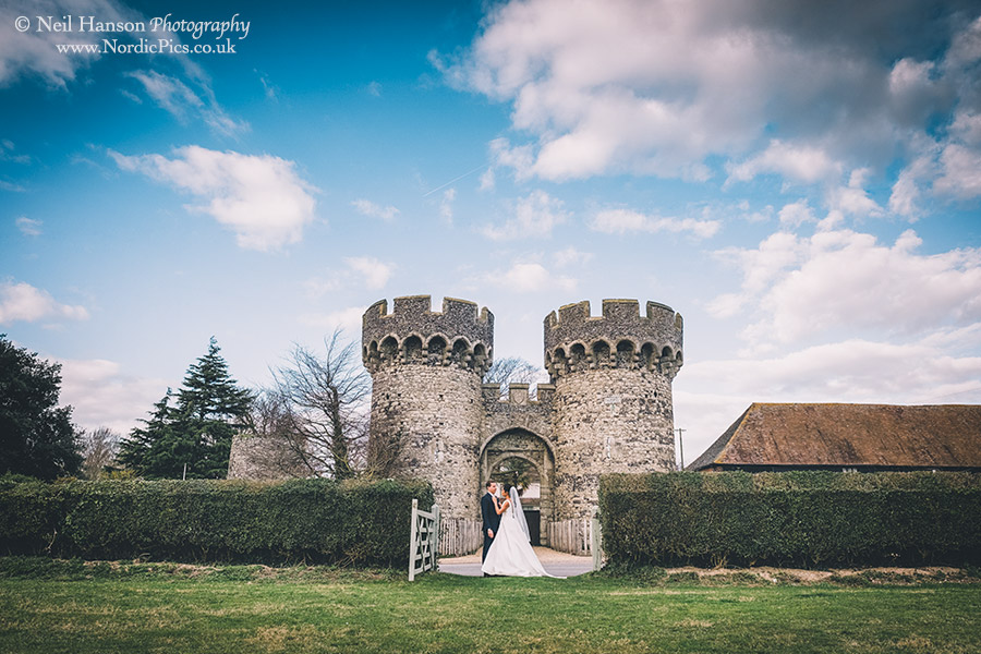 Bride & Groom outside the castle turrets at cooling wedding barn