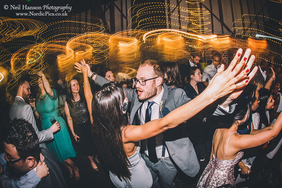 Guests dancing at a Cooling Castle Barn Wedding