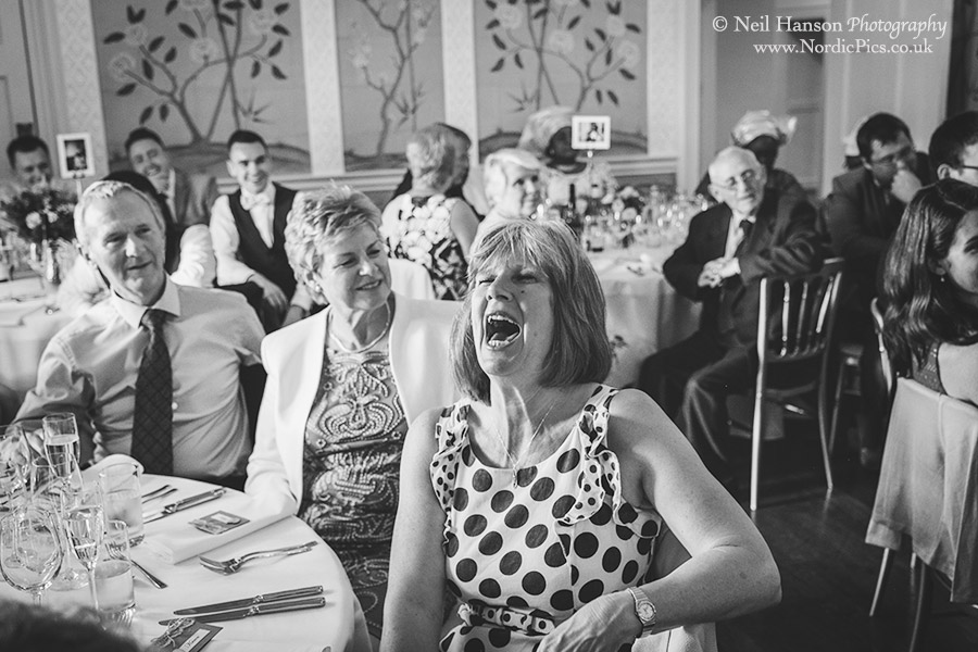hilarious laughter from the wedding guests during the speeches