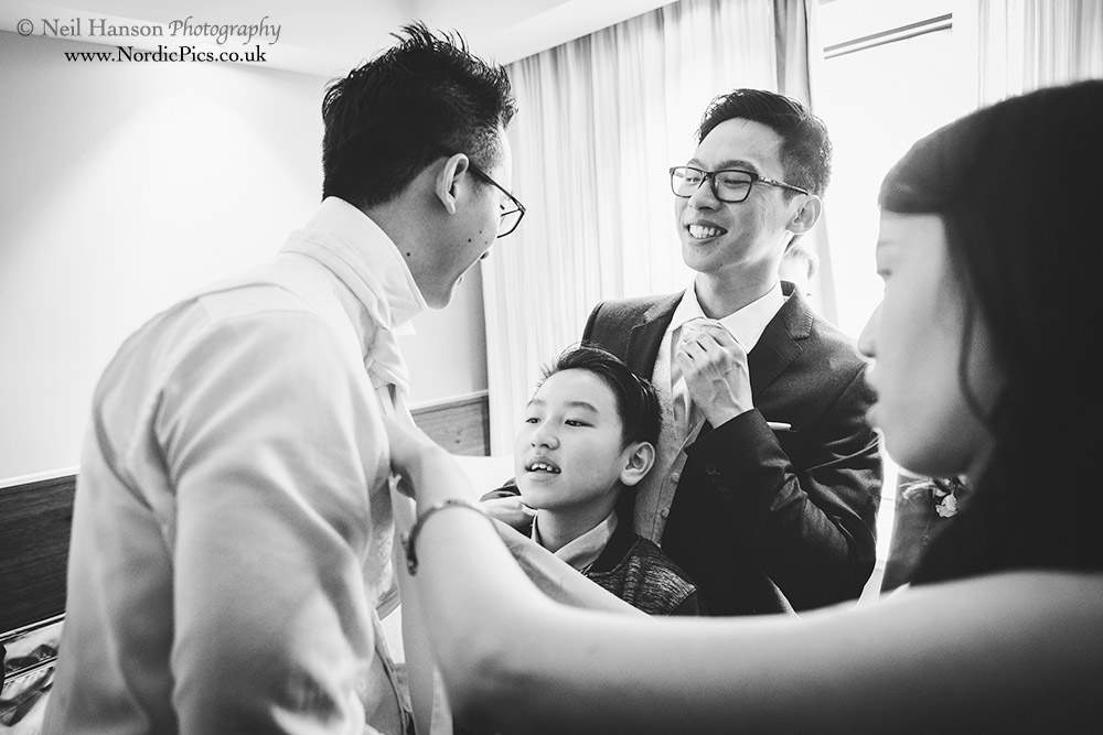 Groom having problems with his tie
